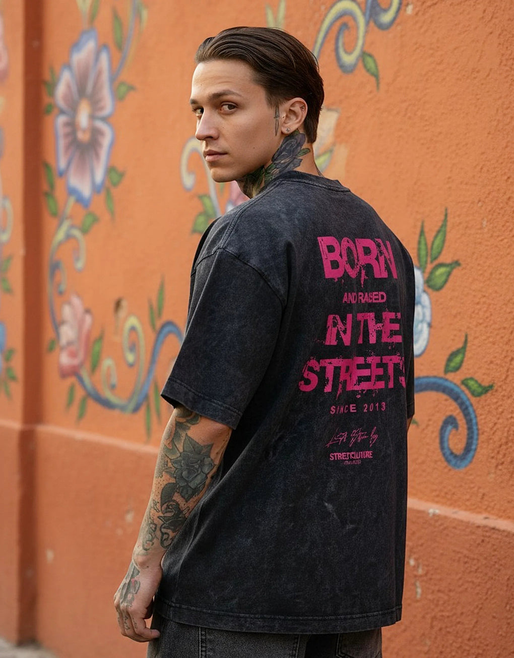 MEGASTORE black washed cotton oversized t-shirt with pink graphic print on back and chest logo.
